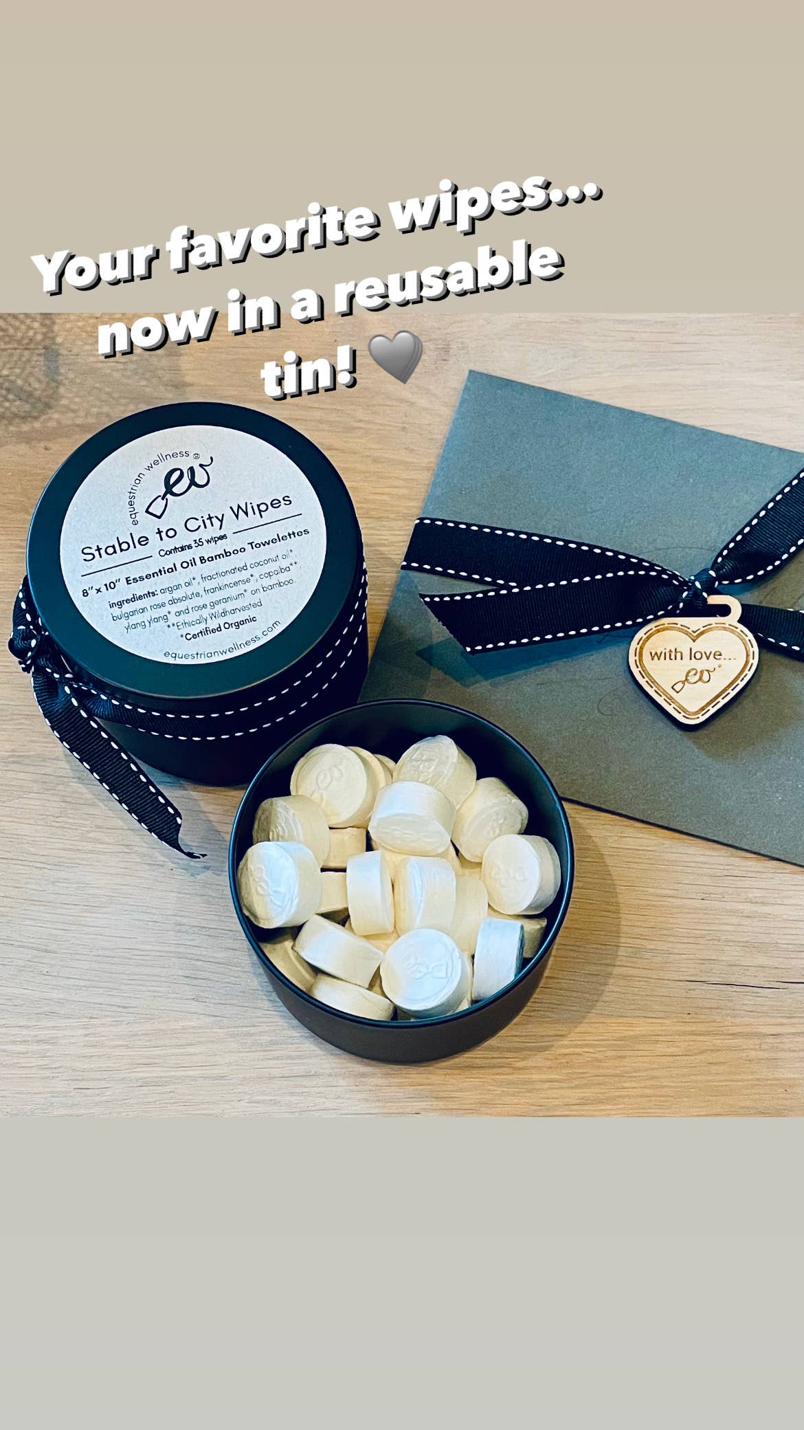 Reusable tin with wipes and a heart-shaped tag on a wooden surface