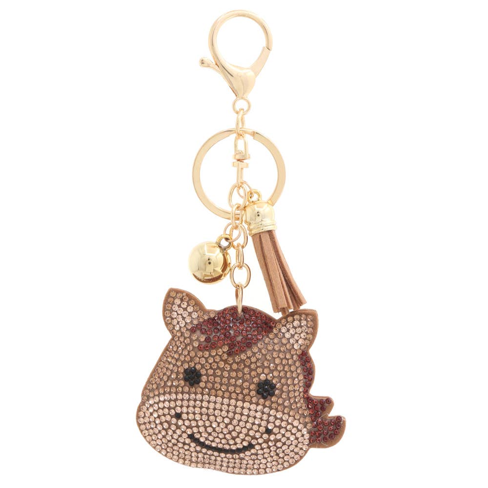 Keychain with a horse design and gold accents on a white background