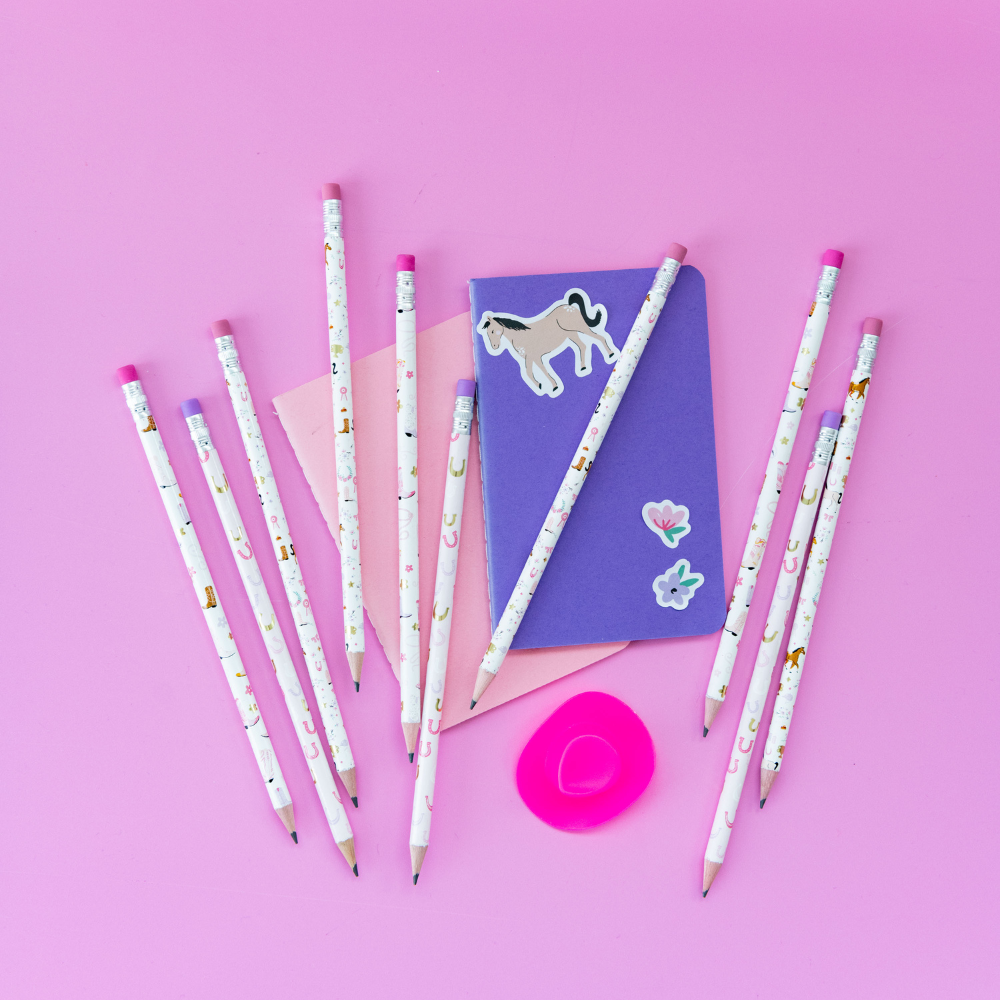 Pencils with pony cartoon designs on a pink background