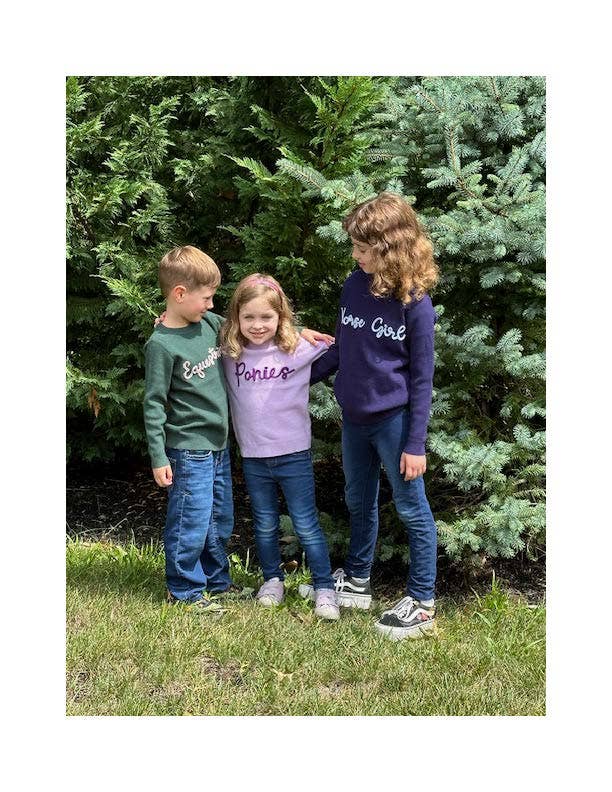 Kids at a farm wearing our stores best selling equestrian sweaters