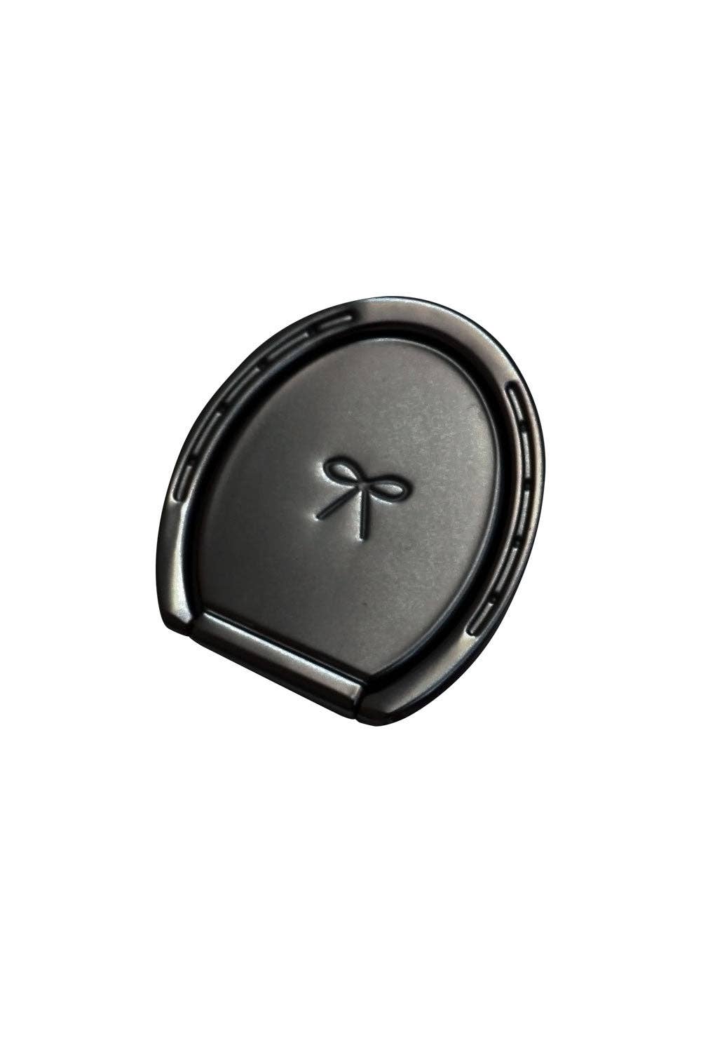 black phone stand shaped like a horse shoe