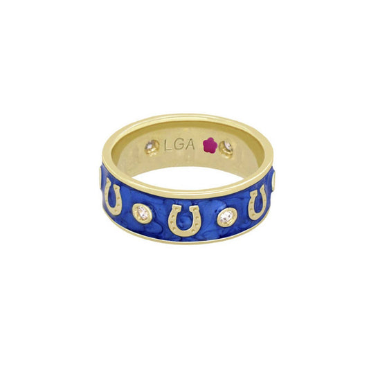 Gold and blue ring with horseshoe design on a white background