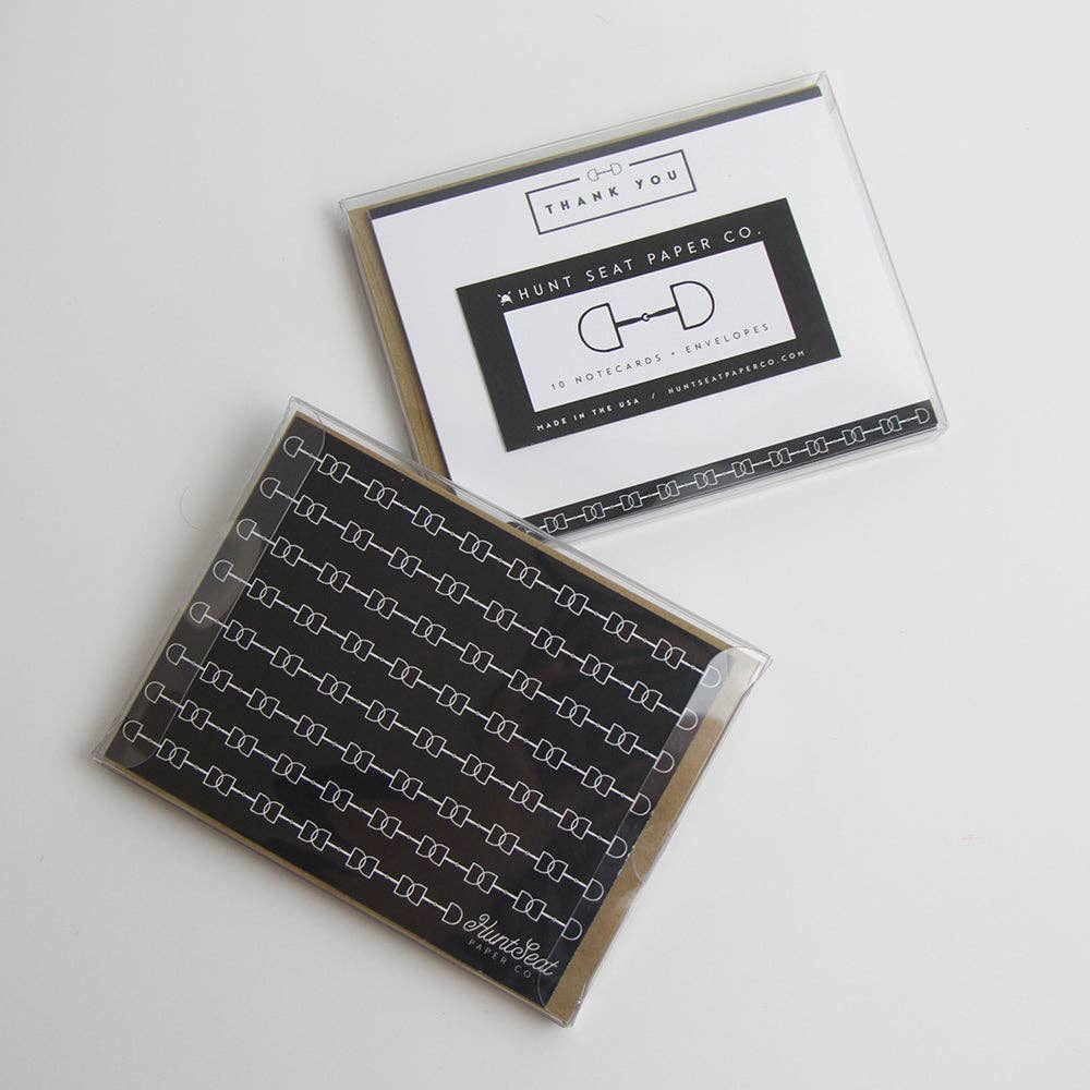 Two greeting cards with black and white equestrian designs on a light gray background