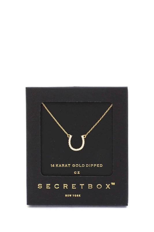 Gold Horseshoe shaped necklace in a SecretBox packaging on a white background