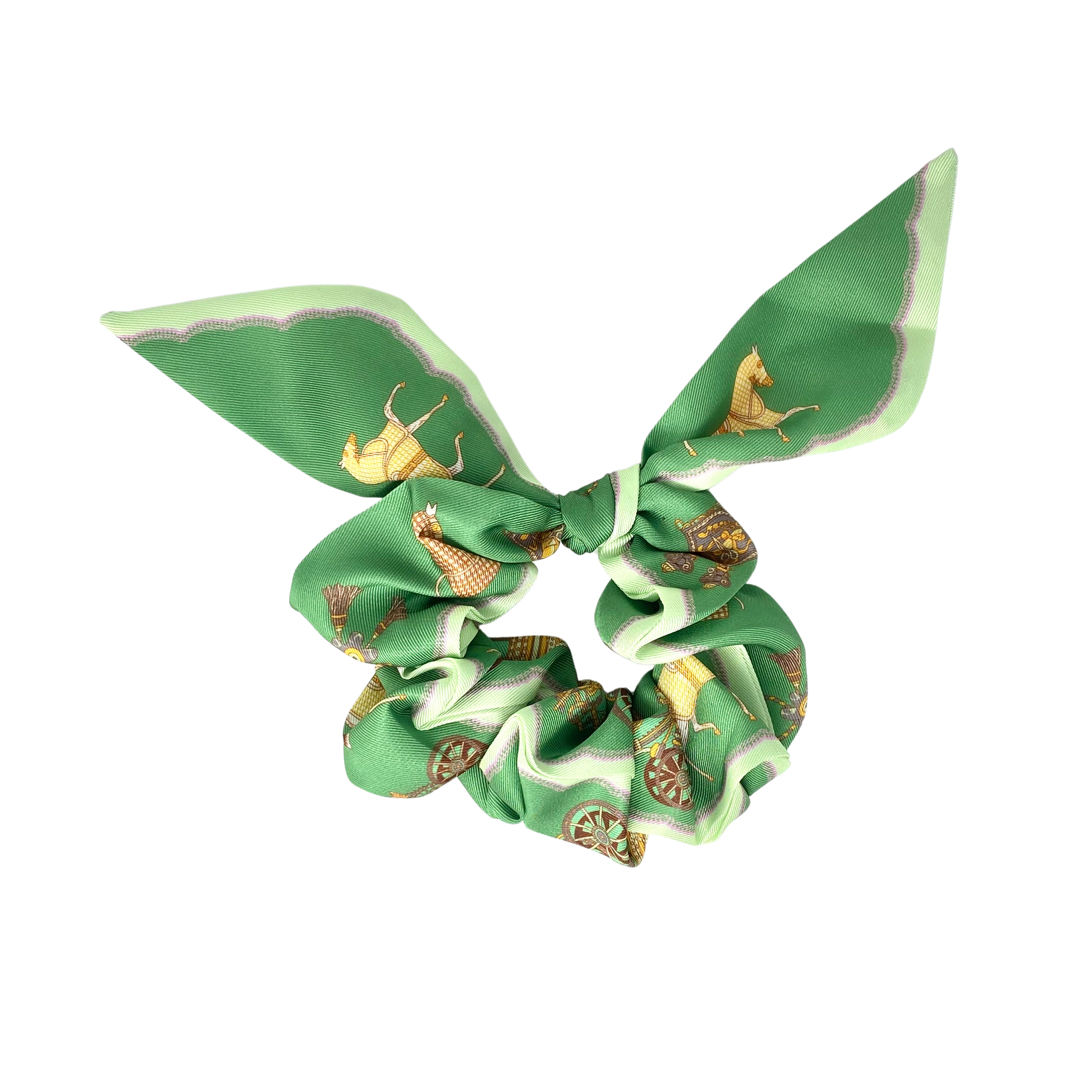 Green scrunchie with gold equestrian print on a white background