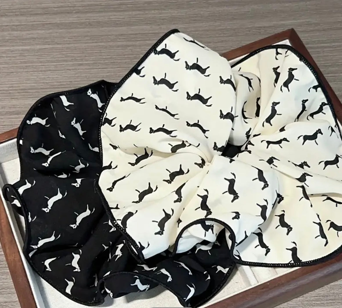Soft cotton hair scrunchie featuring a horse motif pattern, available in cream and black colorways for equestrian styl