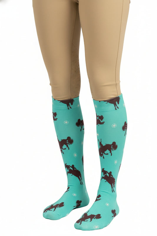 Turquoise knee-high sock with horse pattern on a white background