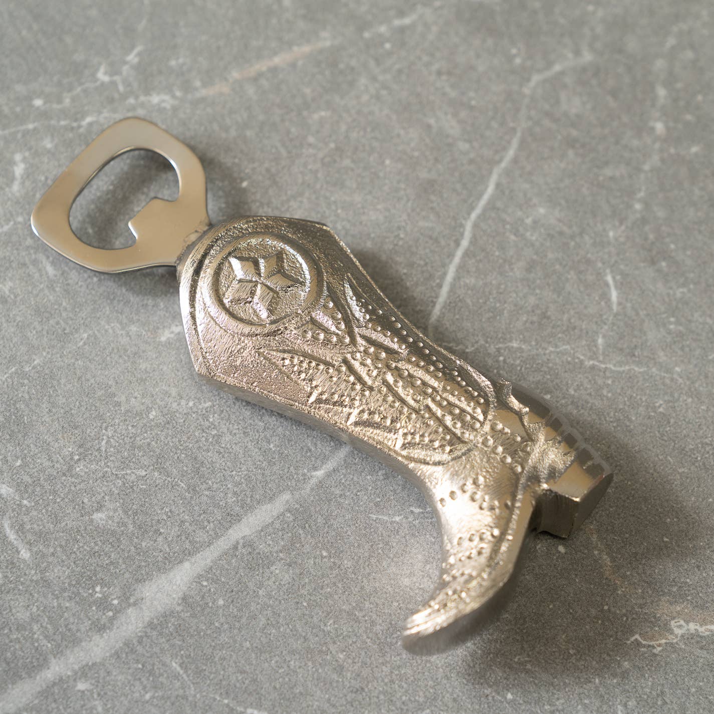 Decorative and functional cowboy boot-shaped bottle opener, ideal for equestrian-themed kitchens, barns, or home bars.