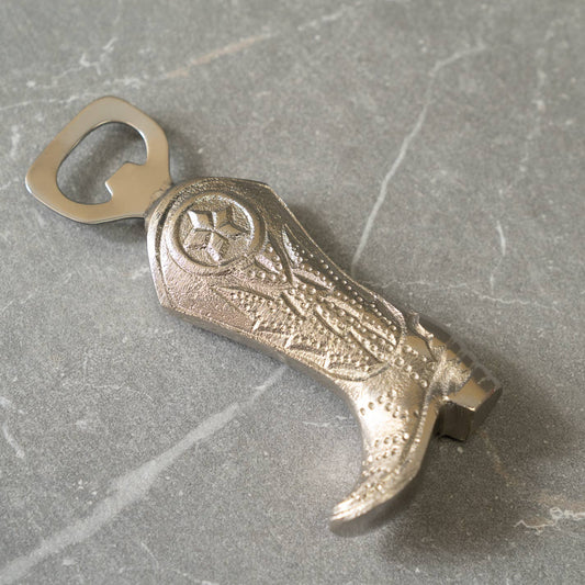 Decorative and functional cowboy boot-shaped bottle opener, ideal for equestrian-themed kitchens, barns, or home bars.