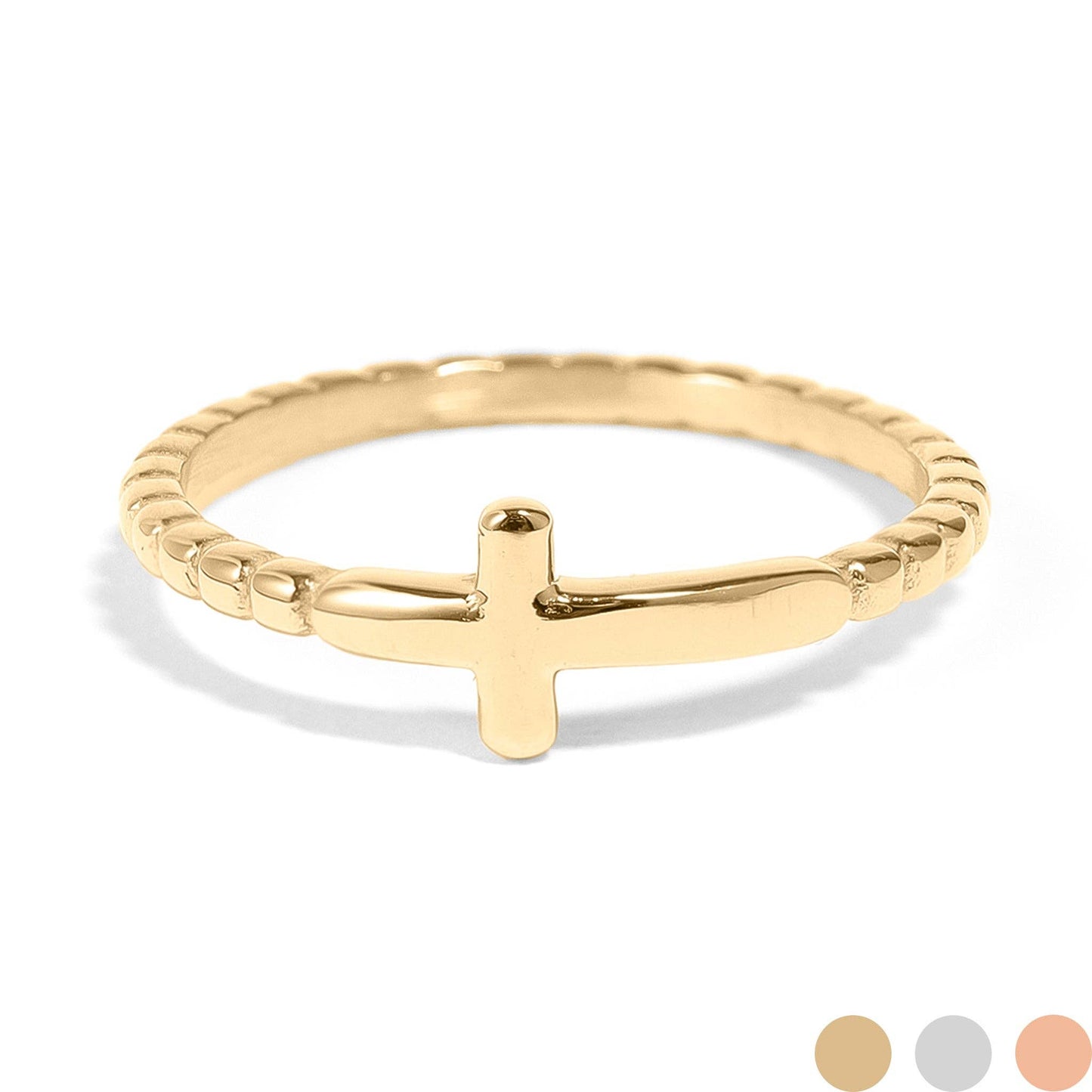 Gold ring with a cross design on a white background
