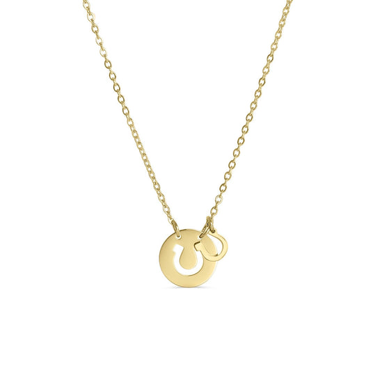 Gold necklace with a circular pendant and horseshoe cutout  on a white background