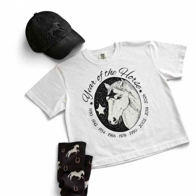 White t-shirt with year of the horse design and text, black cap, and black socks with horse patterns on a white background