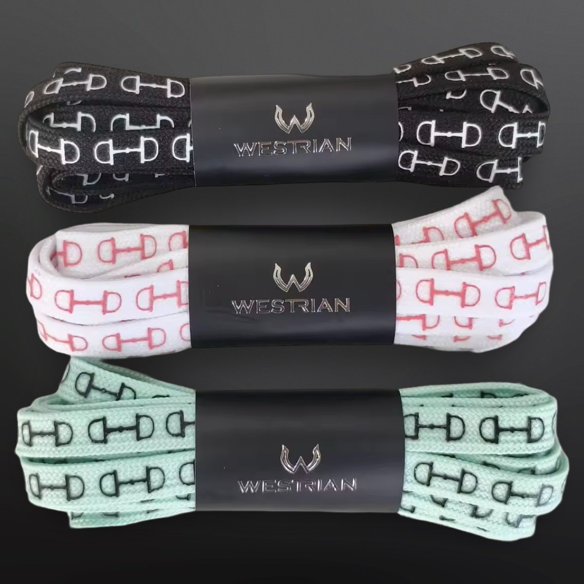 Three pairs of snaffle bit print shoelaces in black, white, and mint colors, packaged with the brand name 'WESTRIAN' on black labels.