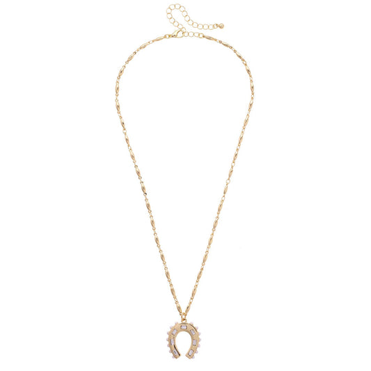 Gold necklace with a horseshoe pendant on a white background