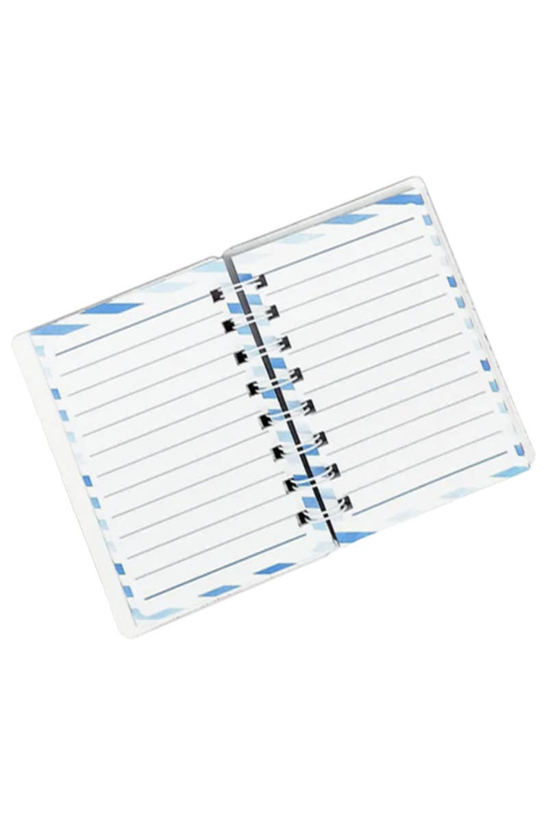 Open mini unicorn notebook with lined pages on a white background