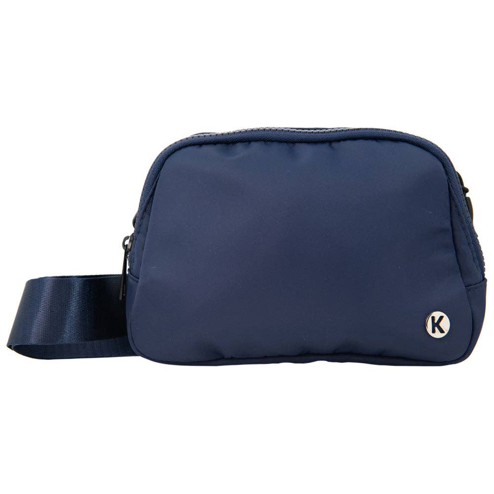 A navy-colored belt bag for women with a front zipper pocket and an adjustable strap, displayed against a plain background.