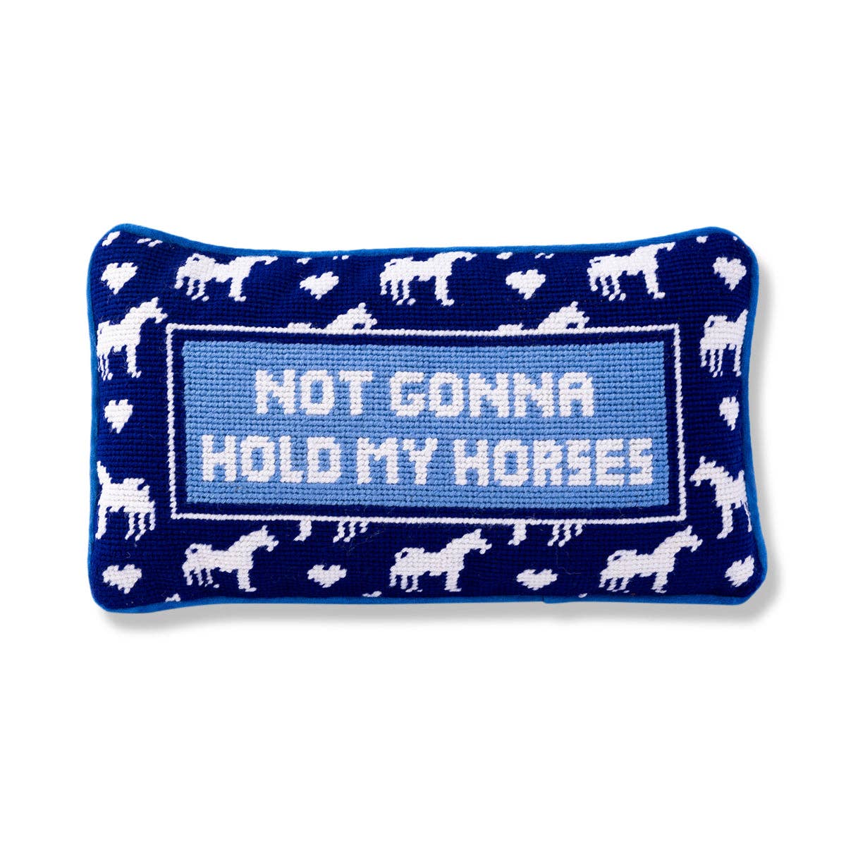 A rectangular needlepoint pillow with a horse shoe pattern and the phrase 'NOT GONNA HOLD MY HORSES' in the center.