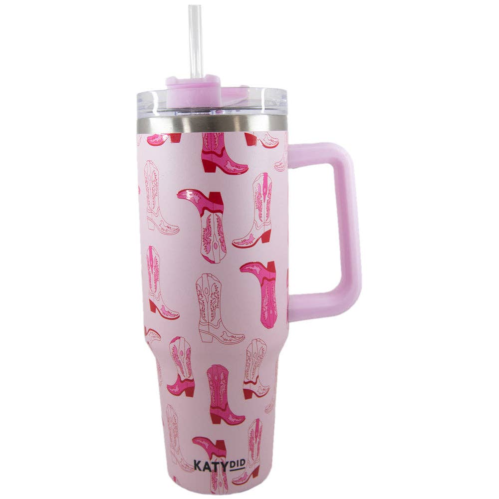 Light pink insulated travel tumbler cup with a handle and western boot and horseshoe pattern, ideal for equestrian barn life.