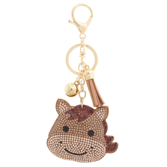 Keychain with a horse design and gold accents on a white background