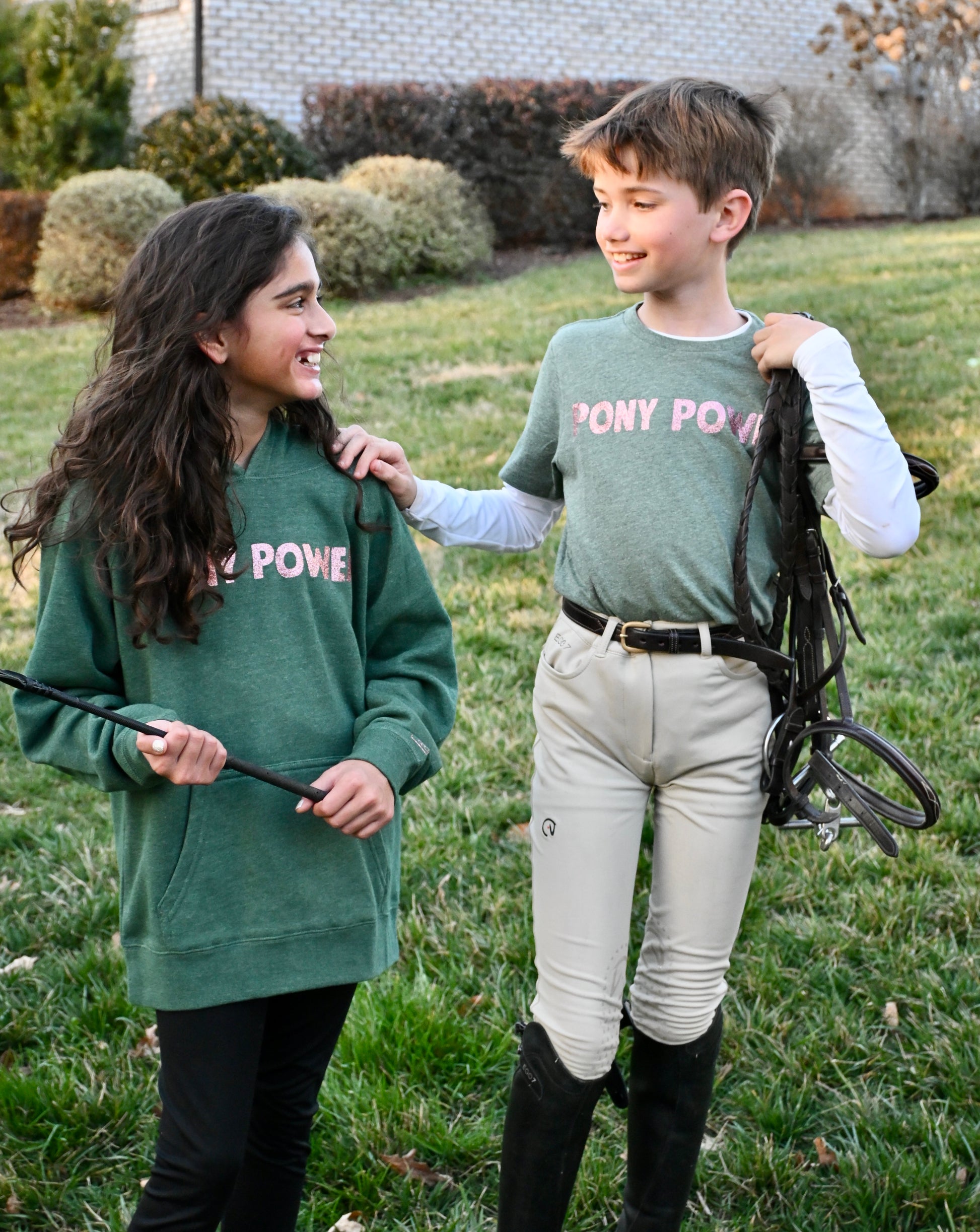 Cozy kids' hooded sweatshirt with "Pony Power" graphic, perfect for keeping young equestrians warm at the stables.