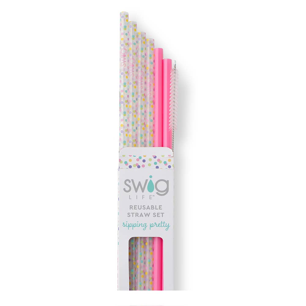 A set of reusable straws by Swig Life, featuring printed and solid pink colors, packaged in a clear plastic case with a cleaning brush.