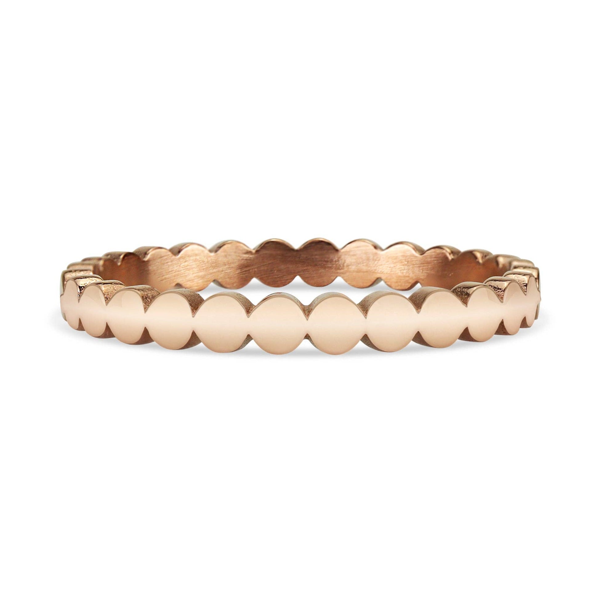 Rose gold beaded bracelet on a white background