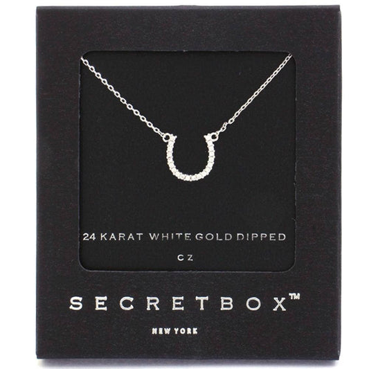 Horseshoe necklace on a Secretbox card with '24 Karat White Gold Dipped' text.