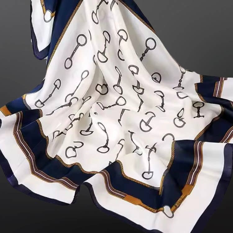 Silk scarf with black horse bit pattern on white background