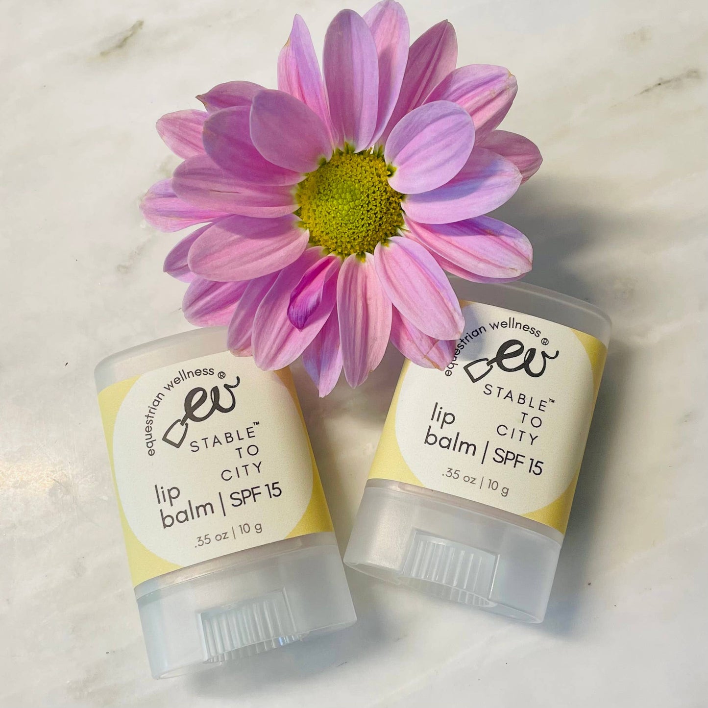 Oval-shaped natural lip balm with cacao butter and beeswax from Trio Equestrian.
