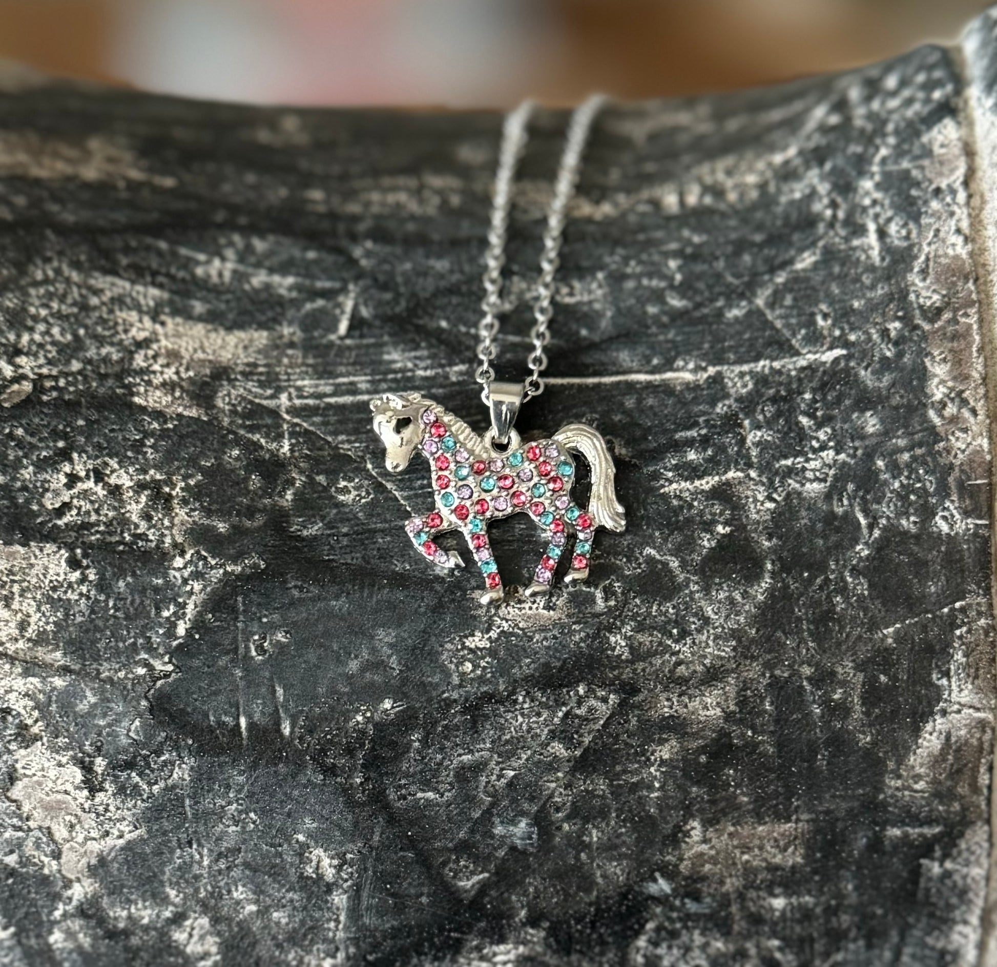 Cute unicorn-shaped necklace featuring sparkling rhinestones, sized specifically for children, perfect for young equestrians.