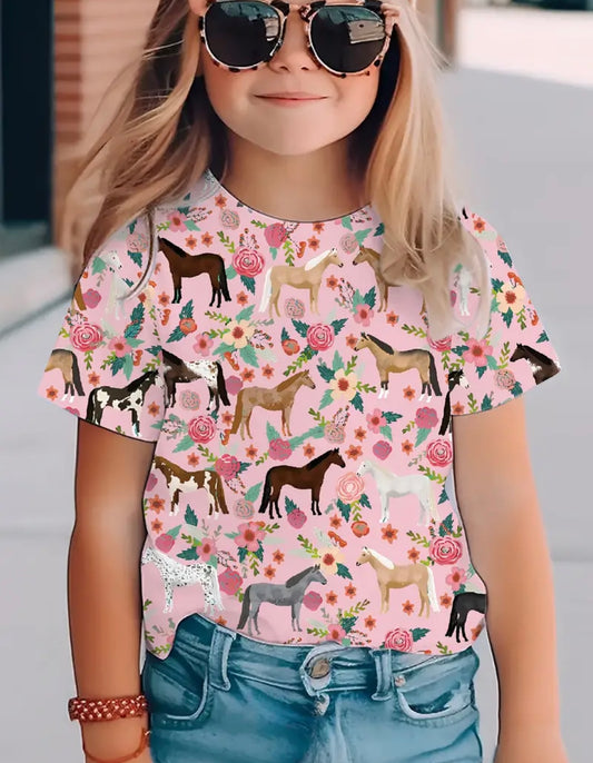 A child wearing sunglasses and a pink crewneck t-shirt with a colorful horse pattern.